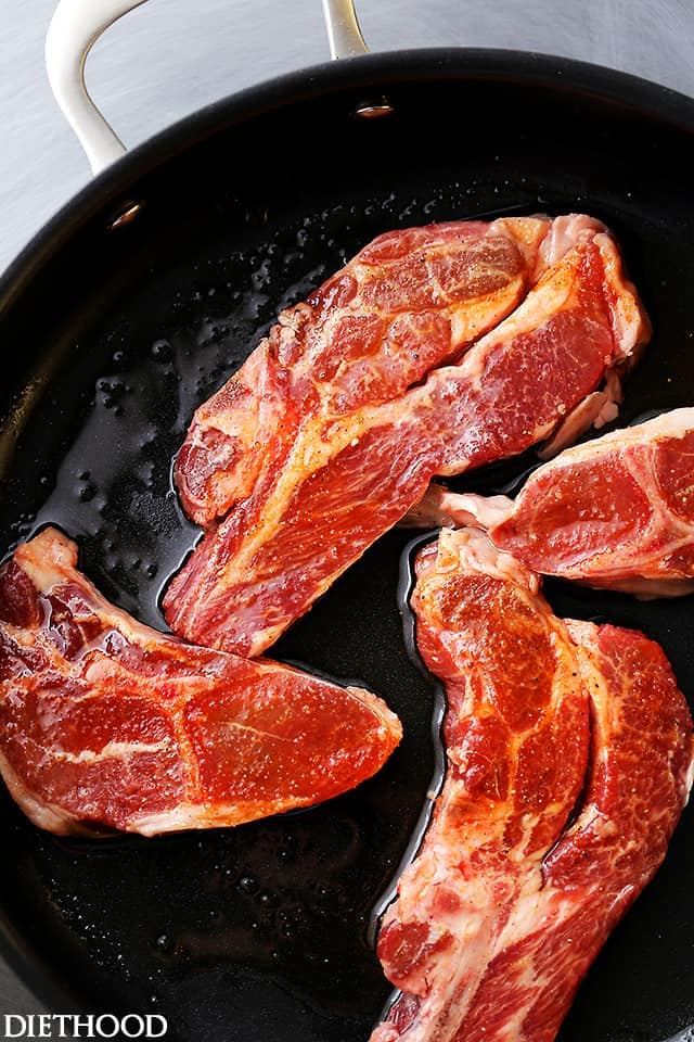 Cooking lamb chops in a skillet.