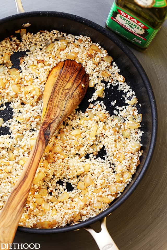 Toasting risotto in a skillet.