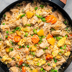Chicken fried rice in a skillet.