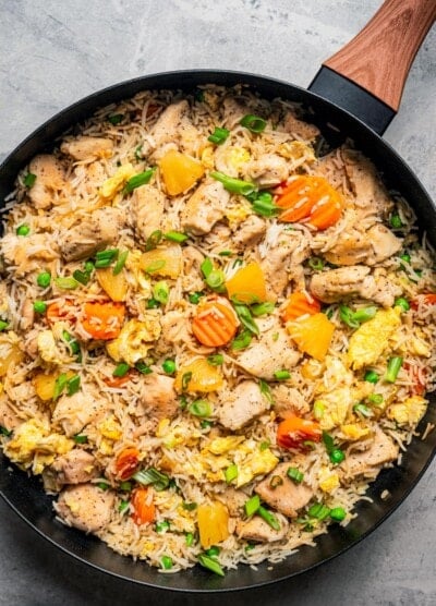 Chicken fried rice in a skillet.