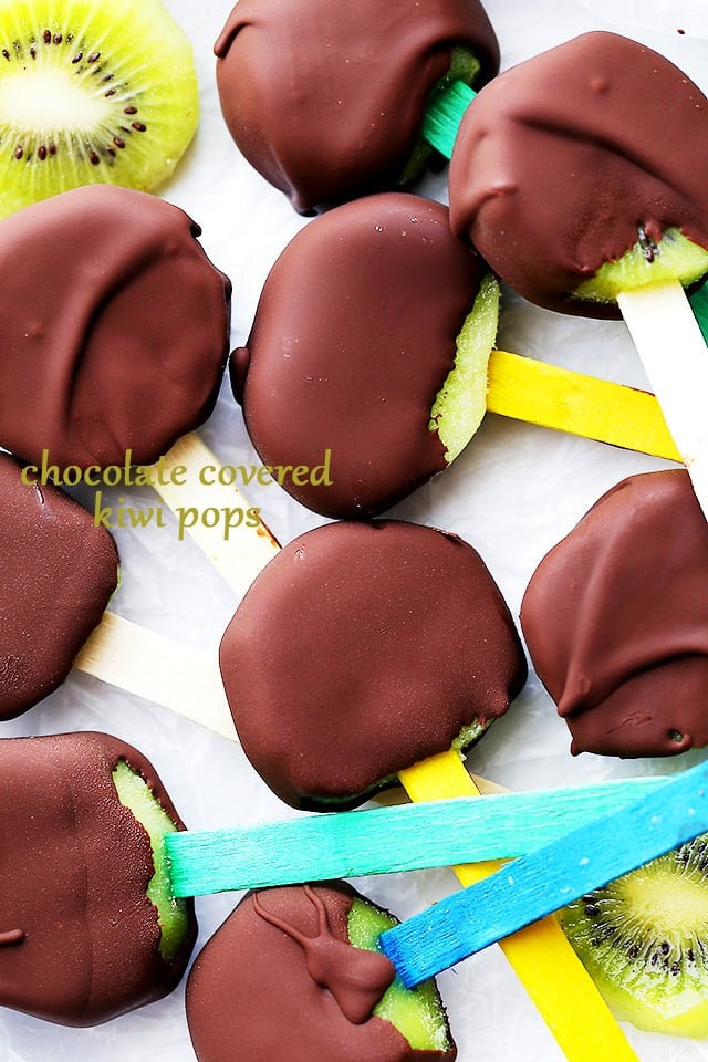 Chocolate Covered Kiwi Pops - Delicious and easy to make healthy snack with kiwi fruit slices dipped in melted chocolate.