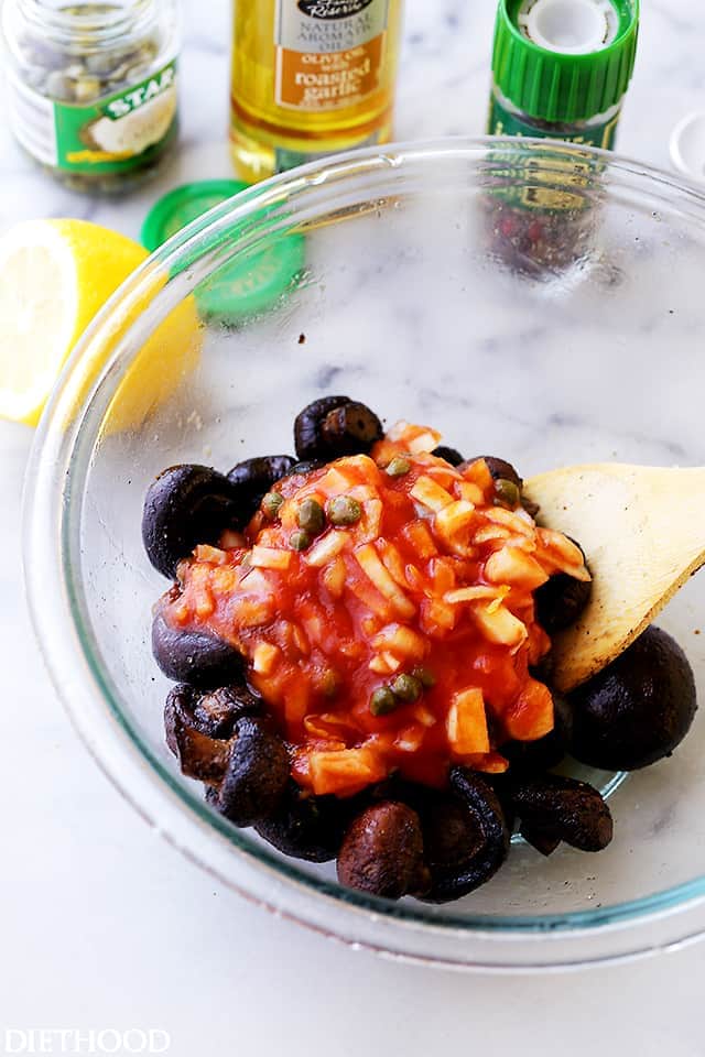 Roasted Italian Mushrooms Recipe - Roasted baby portobello mushrooms tossed with capers and onions in a deliciously seasoned tomato sauce.