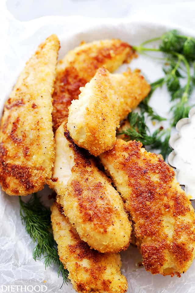 Parmesan-Crusted Chicken Tenders with Buttermilk Ranch Dressing - Flavorful, easy to make crispy parmesan Chicken Tenders coated with panko breadcrumbs and parmesan cheese, served with a side of homemade Buttermilk Ranch Dressing. A delicious meal for the whole family!