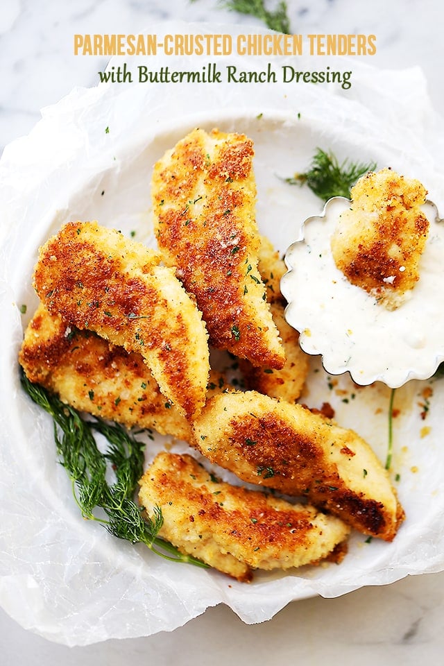 Parmesan-Crusted Chicken Tenders with Buttermilk Ranch Dressing - Flavorful, easy to make crispy parmesan Chicken Tenders coated with panko breadcrumbs and parmesan cheese, served with a side of homemade Buttermilk Ranch Dressing. A delicious meal for the whole family!