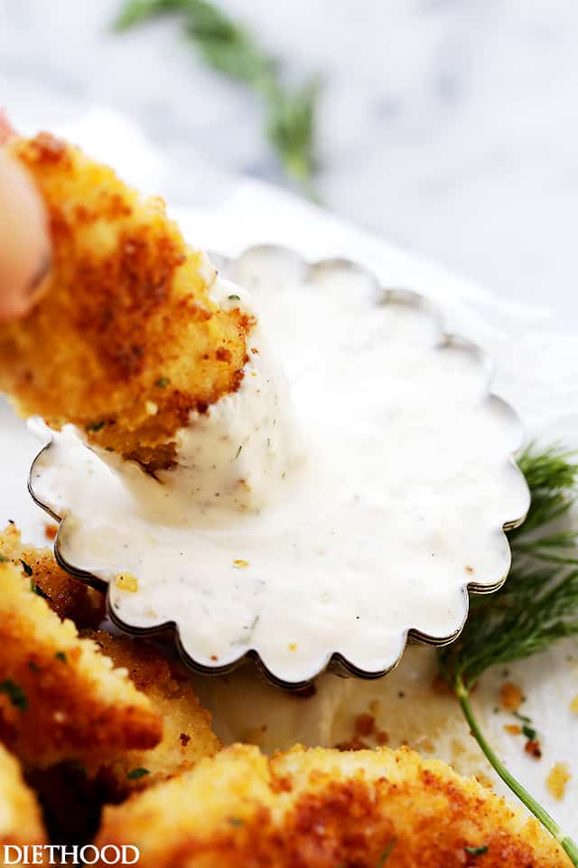 Parmesan-Crusted Chicken Tenders with Buttermilk Ranch Dressing - Flavorful, easy to make crispy parmesan Chicken Tenders coated with panko breadcrumbs and parmesan cheese, served with a side of homemade Buttermilk Ranch Dressing. A delicious meal for the whole family!