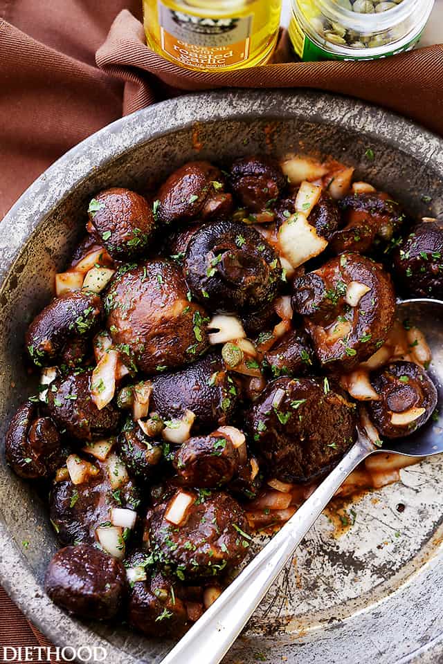 Roasted Italian Mushrooms Recipe - Roasted baby portobello mushrooms tossed with capers and onions in a deliciously seasoned tomato sauce.