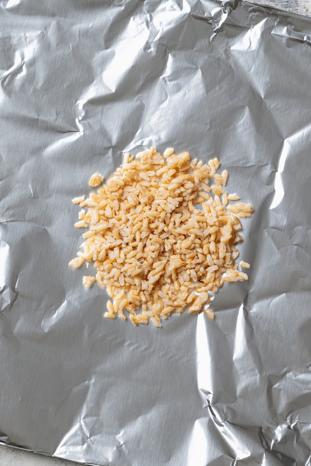 Rice in the center of a piece of foil.