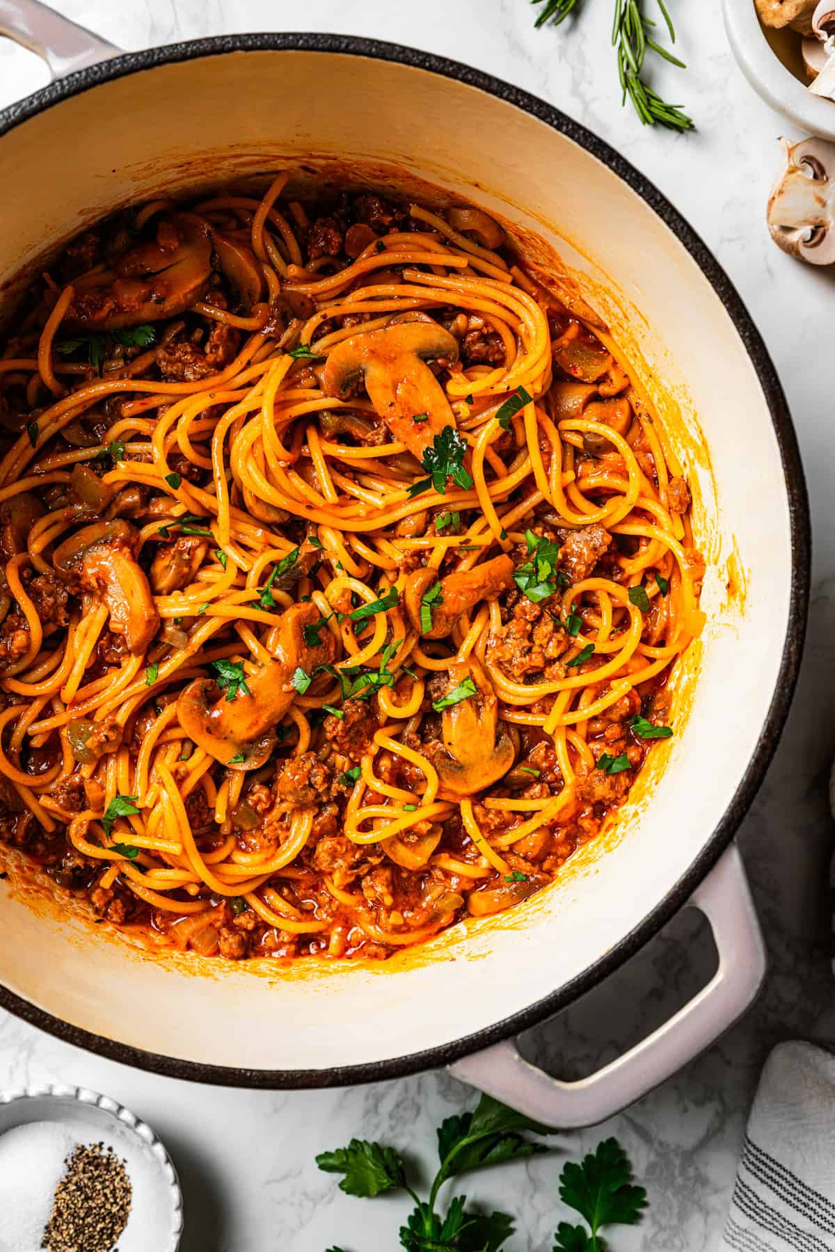 Overhead view of one pot spaghetti and meat in a Dutch oven.