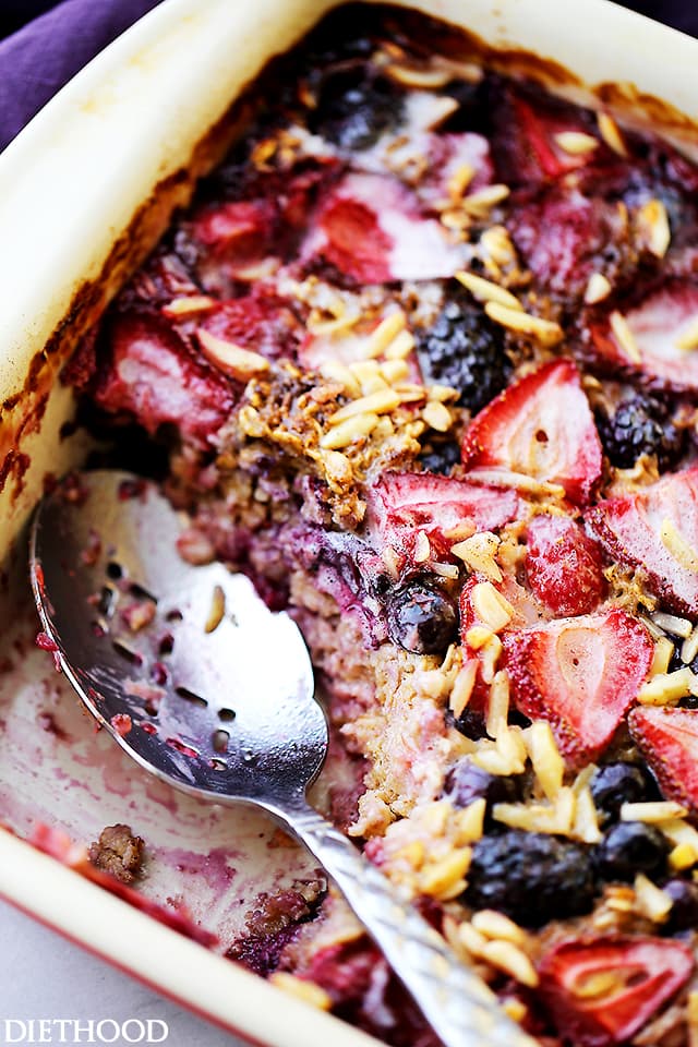 Very Berry Baked Oatmeal - Nutritious and delicious baked oatmeal chock full of irresistible juicy berries and toasted nuts. Make it ahead and reheat portions as needed.
