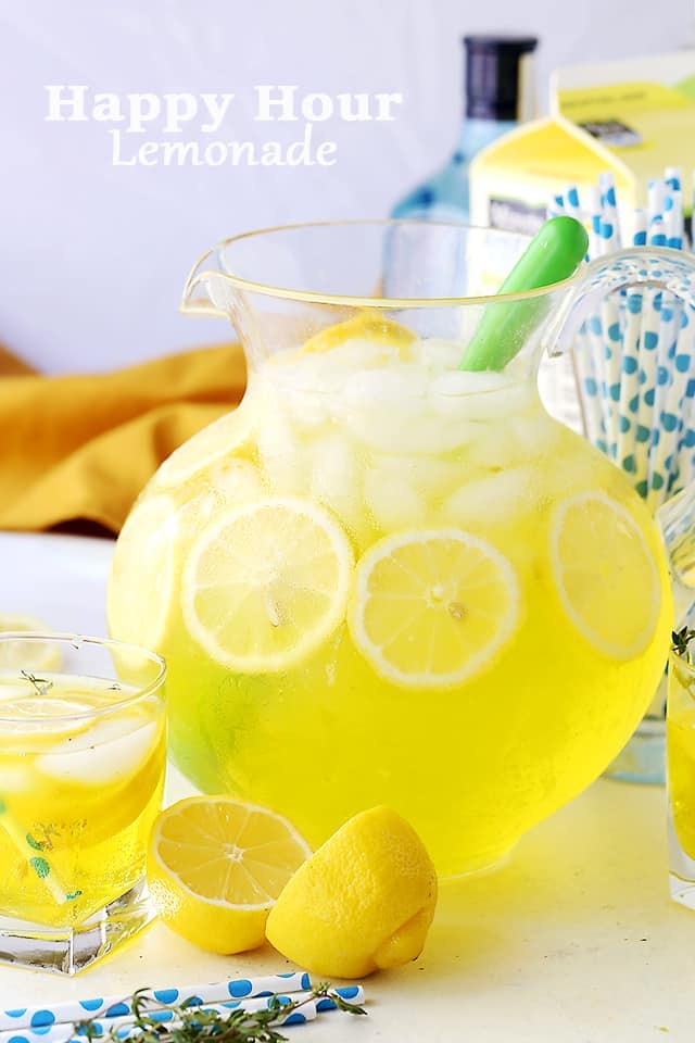 Large pitcher filled with lemonade and lemon slices