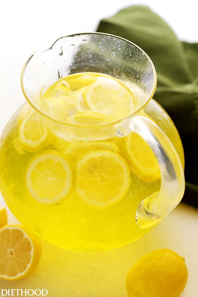 Vodka Lemonade served in a pitcher filled with lemon slices.