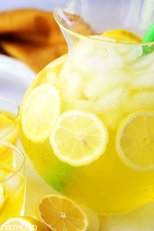 Happy Hour Lemonade - A fun and delicious twist on traditional Lemonade with 7-up, vodka, gin and triple sec. Perfectly refreshing and bright, everyone always comes back for more!