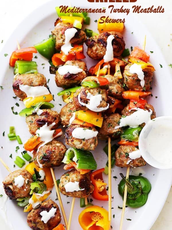 Grilled Mediterranean Turkey Meatballs Skewers - Juicy grilled turkey meatballs stuffed with olives and feta! Makes a delicious dinner, but are also great served as an appetizer, too!