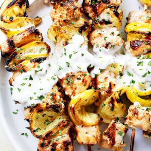 Grilled Salmon Kabobs with Garlic Yogurt Sauce - Tender and moist, these grilled salmon kabobs are juicy with incredible flavor and are served with an amazing garlic yogurt sauce.