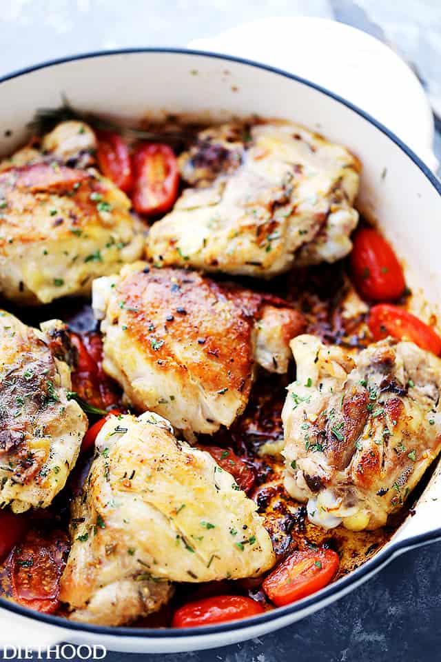 Rosemary chicken and tomatoes in a skillet.