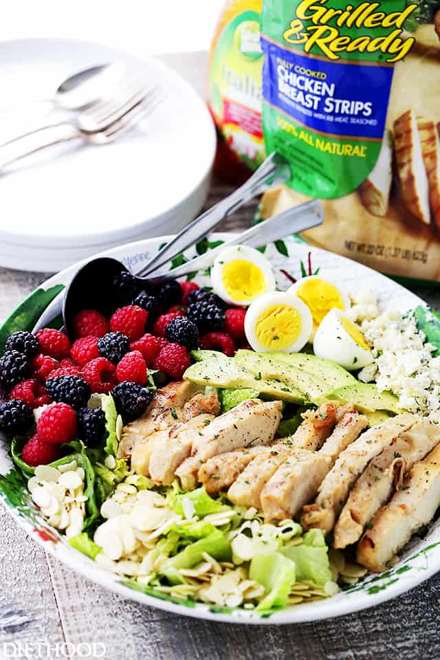 Summer Cobb Salad - Tossed with Italian Dressing, this Cobb Salad is packed with sweet berries, avocado, blue cheese, eggs, and grilled chicken, making it the perfect meal salad for you and your family.