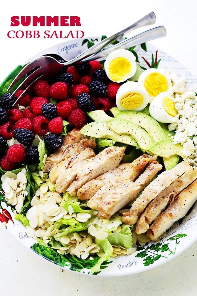 Summer Cobb Salad - Tossed with Italian Dressing, this Cobb Salad is packed with sweet berries, avocado, blue cheese, eggs, and grilled chicken, making it the perfect meal salad for you and your family.