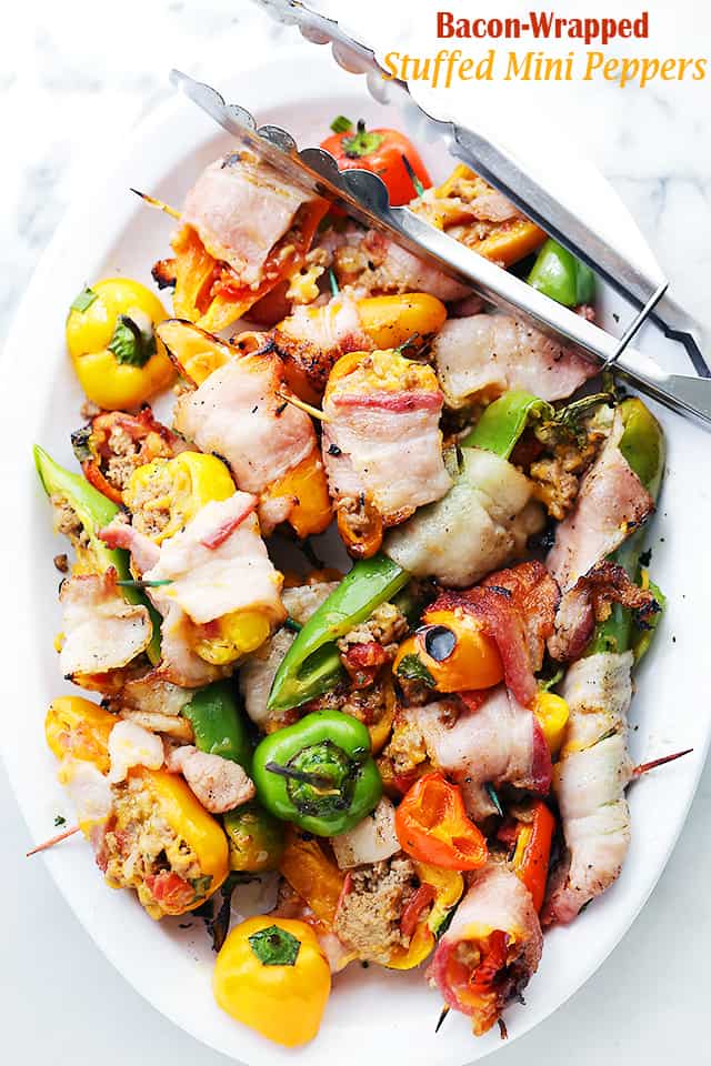 Grilled Bacon-Wrapped Stuffed Mini Peppers - Delicious bacon wrapped around tasty mini peppers stuffed with a flavorful ground turkey and tomatoes mixture, and cooked on the grill!