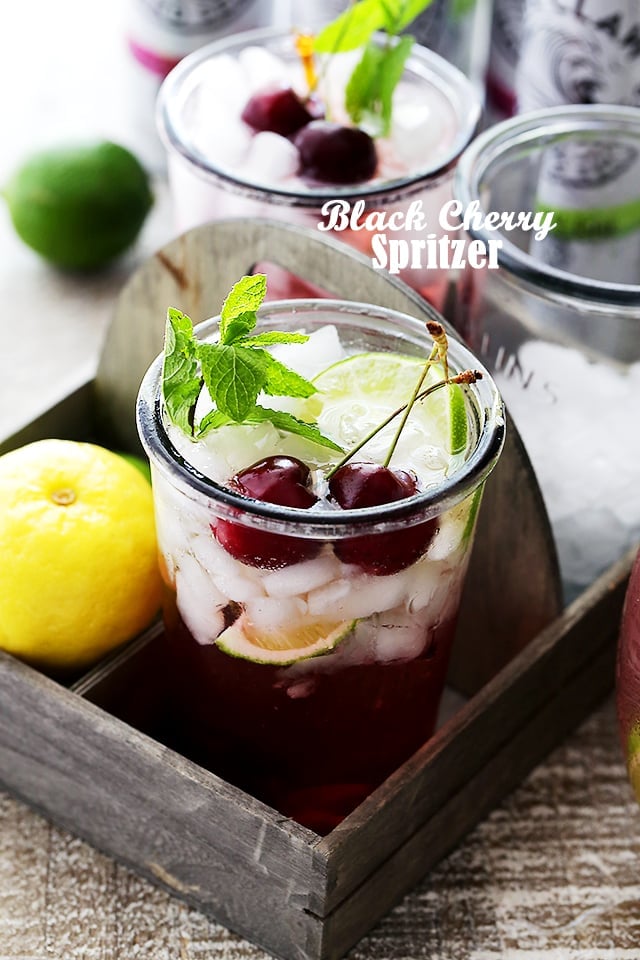 Black Cherry Spritzer - A sweet and refreshing mixture of homemade cherry syrup paired with a black cherry flavored seltzer water. Serve this up at your next summer gathering and watch it all disappear!
