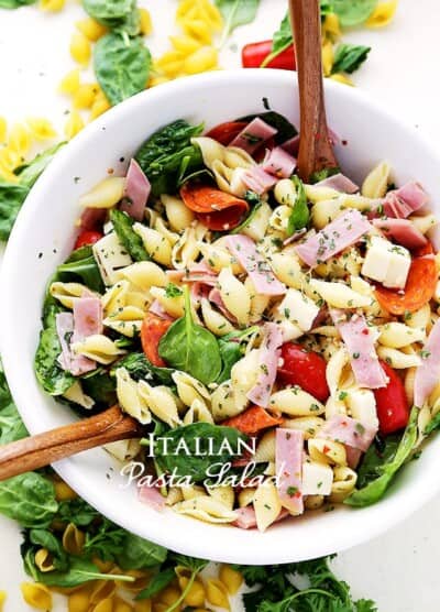 Italian Pasta Salad Recipe - Loaded with all your Italian favorites, like pepperoni, ham, tomatoes, spinach and cheese, this is the perfect pasta salad for any cookout, picnic or light summer meal.