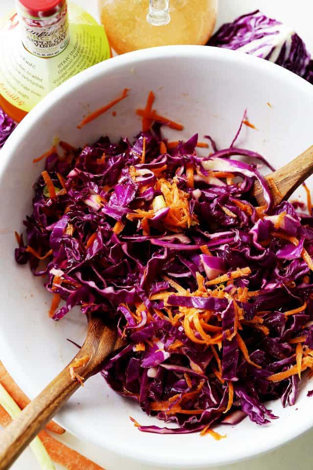 Red Cabbage and Carrot Slaw in a white salad bowl.