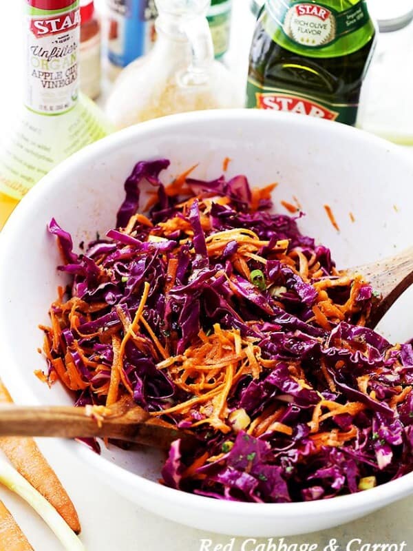 Red Cabbage and Carrot Slaw Recipe - Tossed with an incredible Apple Cider Vinaigrette, this tangy slaw is light, crunchy, refreshing, and serves perfectly as a side dish or even an appetizer.