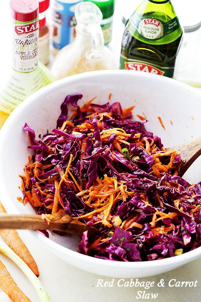 Red Cabbage and Carrot Slaw Recipe - Tossed with an incredible Apple Cider Vinaigrette, this tangy slaw is light, crunchy, refreshing, and serves perfectly as a side dish or even an appetizer.