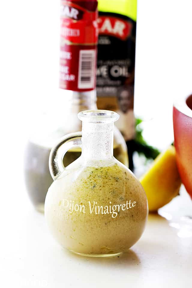A glass bottle of homemade Dijon Vinaigrette 