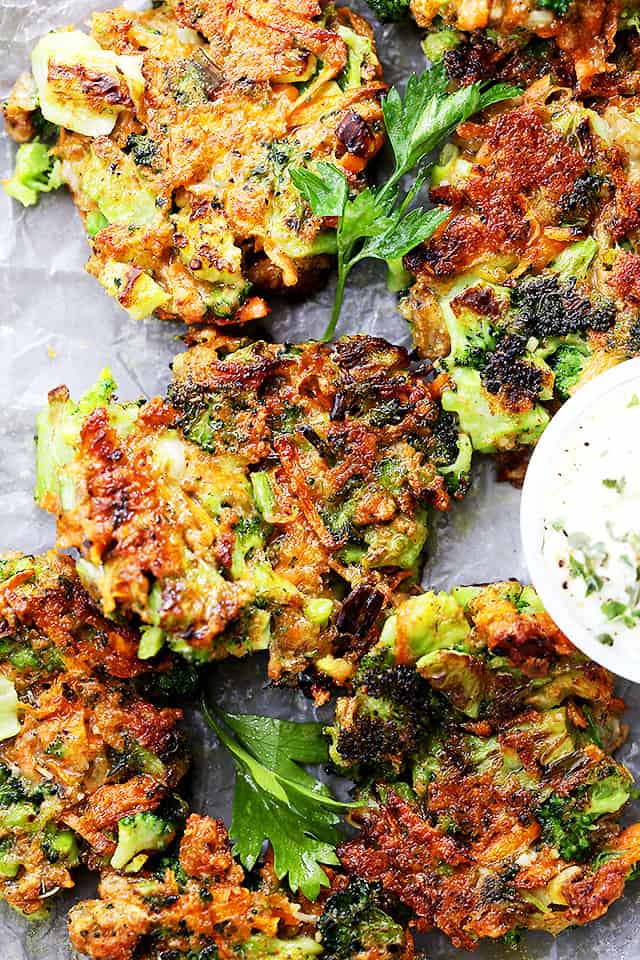 Garlicky and Cheesy Broccoli Fritters - Delicious and crispy fritters loaded with broccoli, carrots, garlic and cheese. Perfect as a side dish, a snack, or an appetizer!