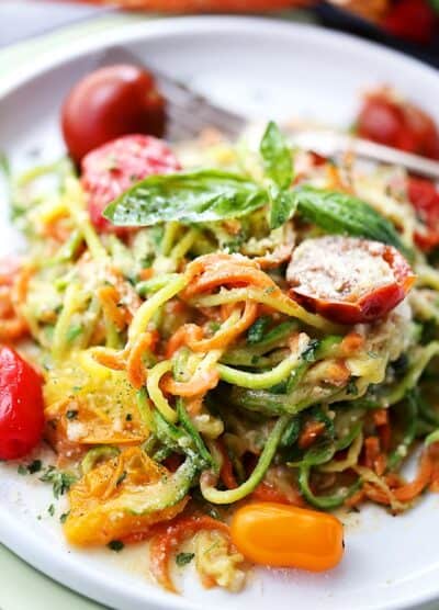 Carrot and Zucchini Noodles in Light Alfredo Sauce - Quick, easy, and healthy dish with carrots and zucchini "noodles" tossed in a light alfredo sauce. Fresh and delicious!