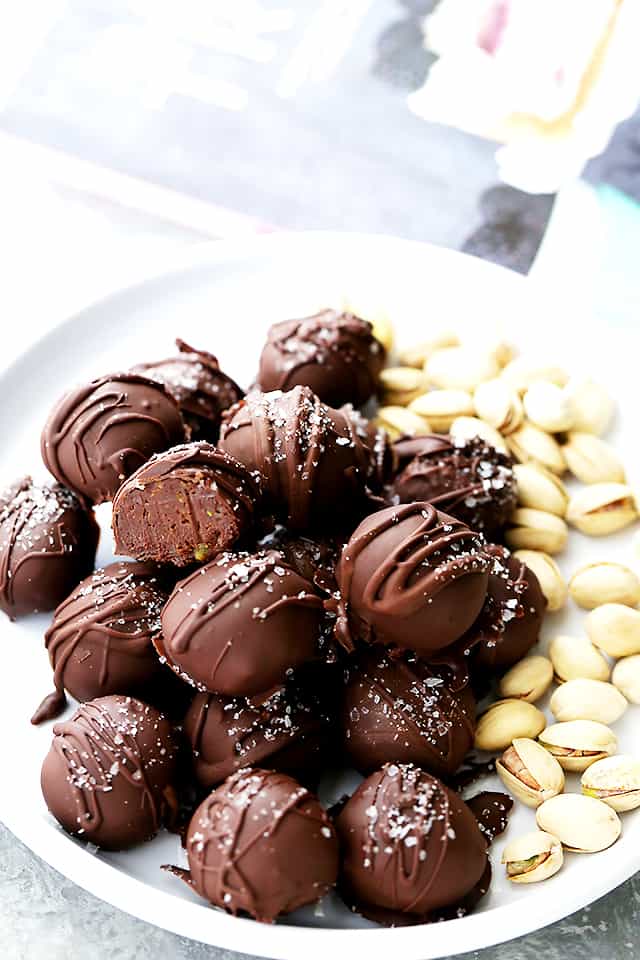 Salted Pistachio Dark Chocolate Truffles - Decadent chocolate truffles made with a rich dark chocolate and pistachio mixture, and sprinkled with sea salt.