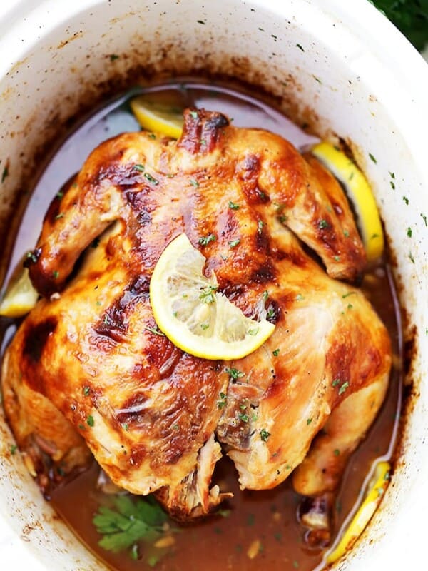 Crock Pot Honey Lemon Chicken Recipe - Rubbed with lemon-pepper butter and a sweet honey sauce, this is the easiest, most delicious whole chicken prepared in the crock pot!