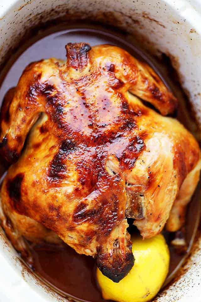 Crock Pot Honey Lemon Chicken Recipe - Rubbed with lemon-pepper butter and a sweet honey sauce, this is the easiest, most delicious whole chicken prepared in the crock pot!