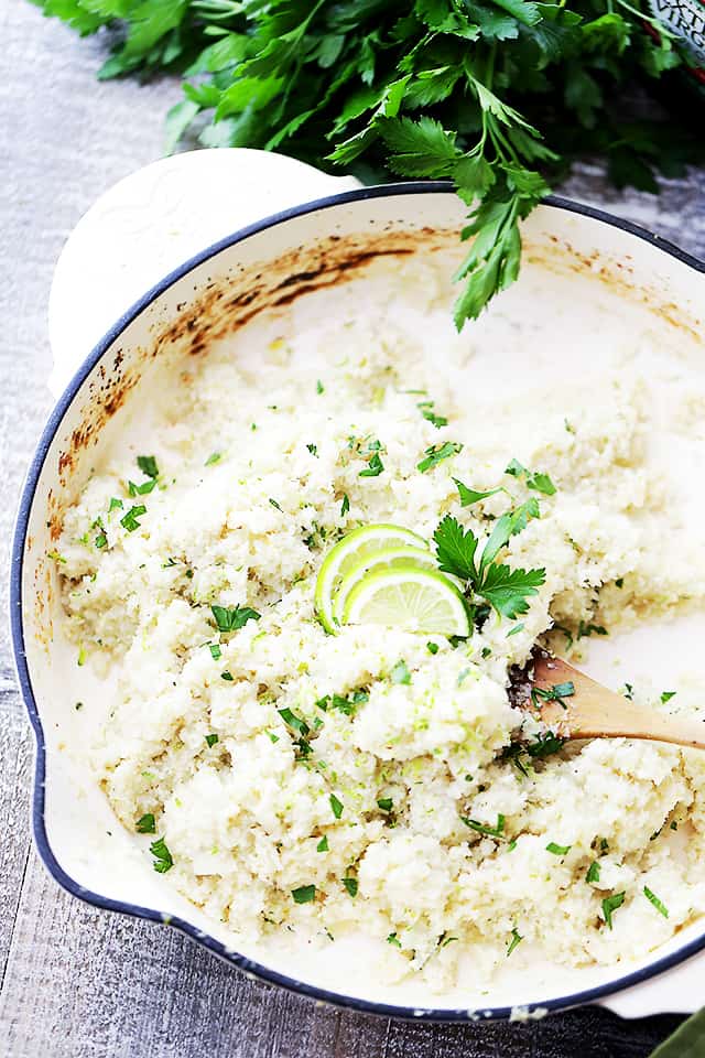 Coconut Lime Cauliflower "Rice" - Cauliflower rice cooked in coconut milk and loaded with fresh lime juice and lime zest! This is the ideal low-carb side dish to any meal!