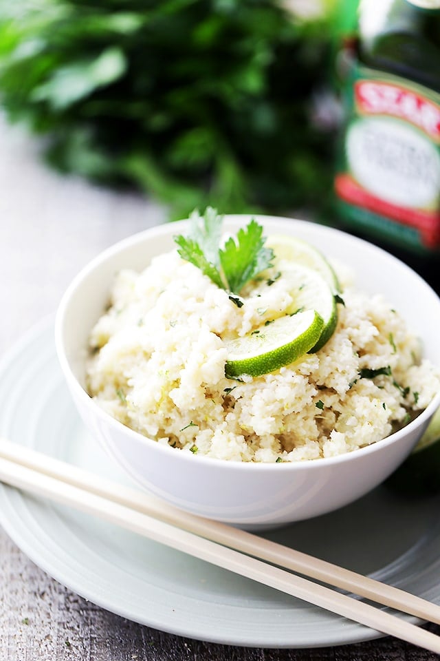 Coconut Lime Cauliflower "Rice" - Cauliflower rice cooked in coconut milk and loaded with fresh lime juice and lime zest! This is the ideal low-carb side dish to any meal!