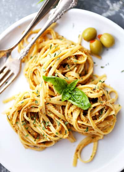 Olive Pesto Pasta Recipe - Quick and easy pasta dinner tossed in a homemade olive pesto made with pimiento-stuffed olives, fresh basil, and sun-dried tomatoes.