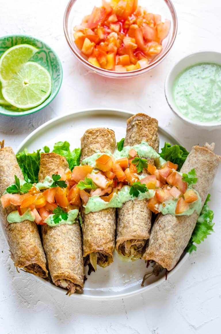 Oven-Baked Pulled Pork Flautas with Avocado Crema | Diethood