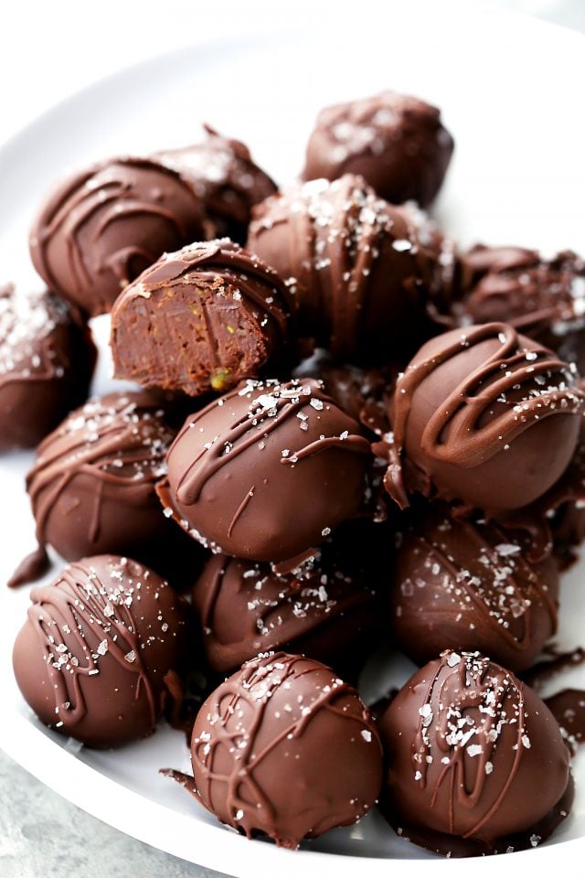 Salted Pistachio Dark Chocolate Truffles - Decadent chocolate truffles made with a rich dark chocolate and pistachio mixture, and sprinkled with sea salt.