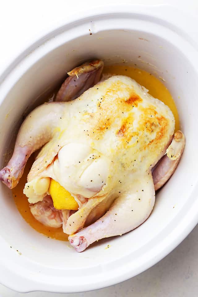 Crock Pot Honey Lemon Chicken Recipe - Rubbed with lemon-pepper butter and a sweet honey sauce, this is the easiest, most delicious whole chicken prepared in the crock pot! 