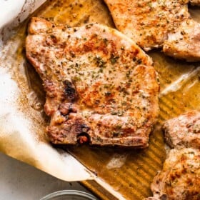 cooked ranch pork chops on a baking sheet