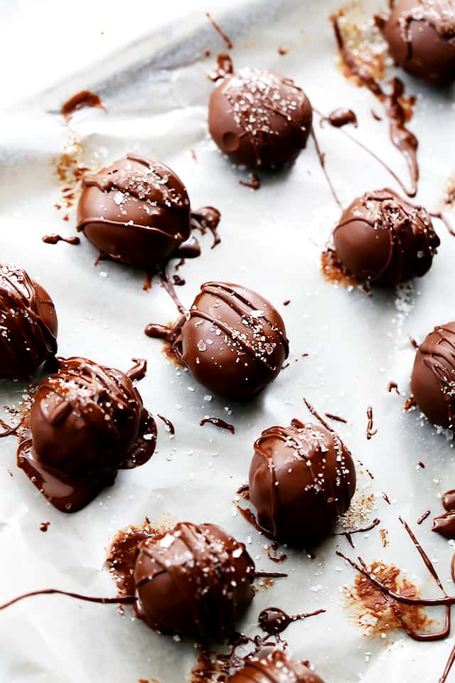 Homemade Chocolate truffles set on parchment paper.