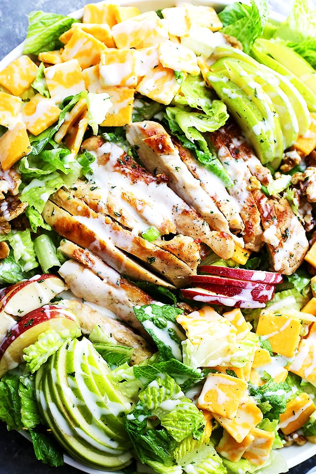 Apples and Cheddar Chicken Salad arranged on a large round platter