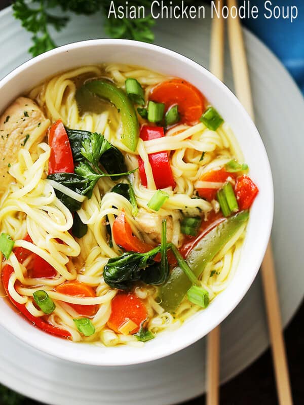 Asian Chicken Noodle Soup - A flavorful and delicious twist on the classic Chicken Noodle Soup featuring ginger, teriyaki sauce, egg noodles, and colorful vegetables, and it's ready in about 30 minutes!
