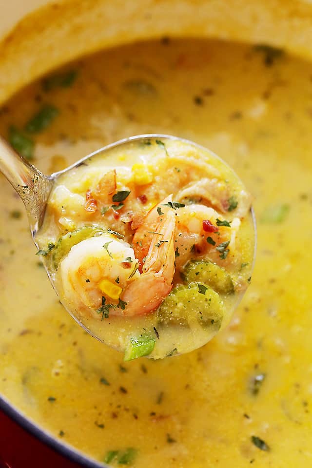 Close-up picture of a ladle spooning out Shrimp Corn Chowder.
