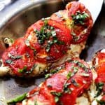 Caprese Skillet Chicken Recipe - Pan-seared chicken topped with melting mozzarella cheese, fresh tomatoes, a sprinkle of basil, and a drizzle of balsamic vinegar. Quick, easy, and SO delicious!