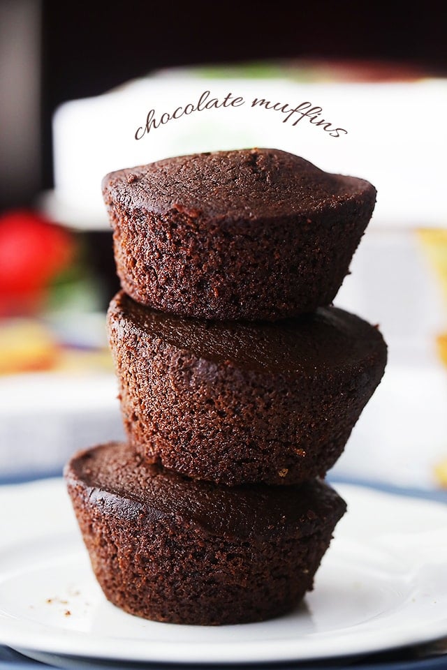 Three Chocolate Veggie Muffins stacked on a plate