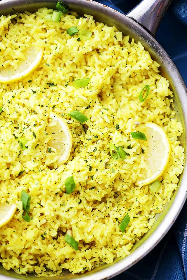 Close-up overhead shot of lemon rice topped with lemon slices.