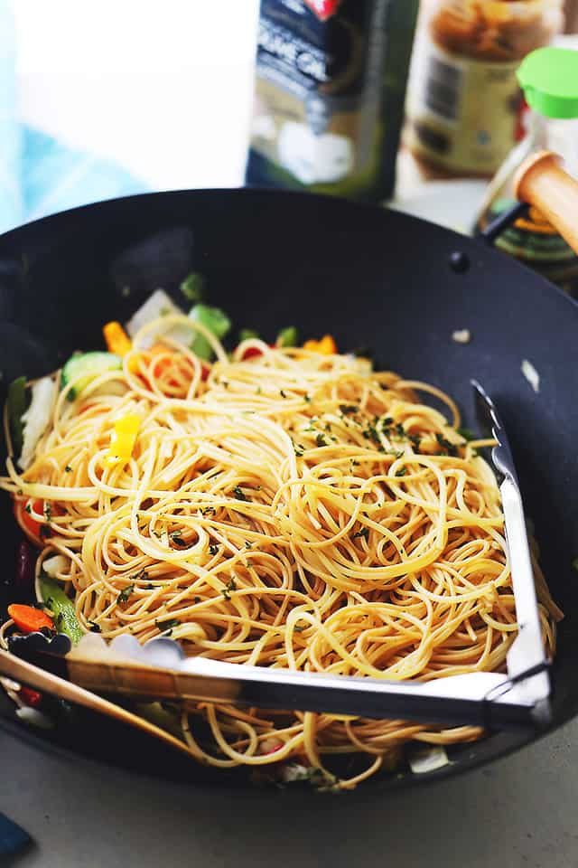 Garlic Peanut Noodles Recipe - Delicious noodles and stir fried vegetables are tossed in garlic olive oil and coated in a mixture of peanut butter, soy sauce, lime juice, hot sauce and ginger. 