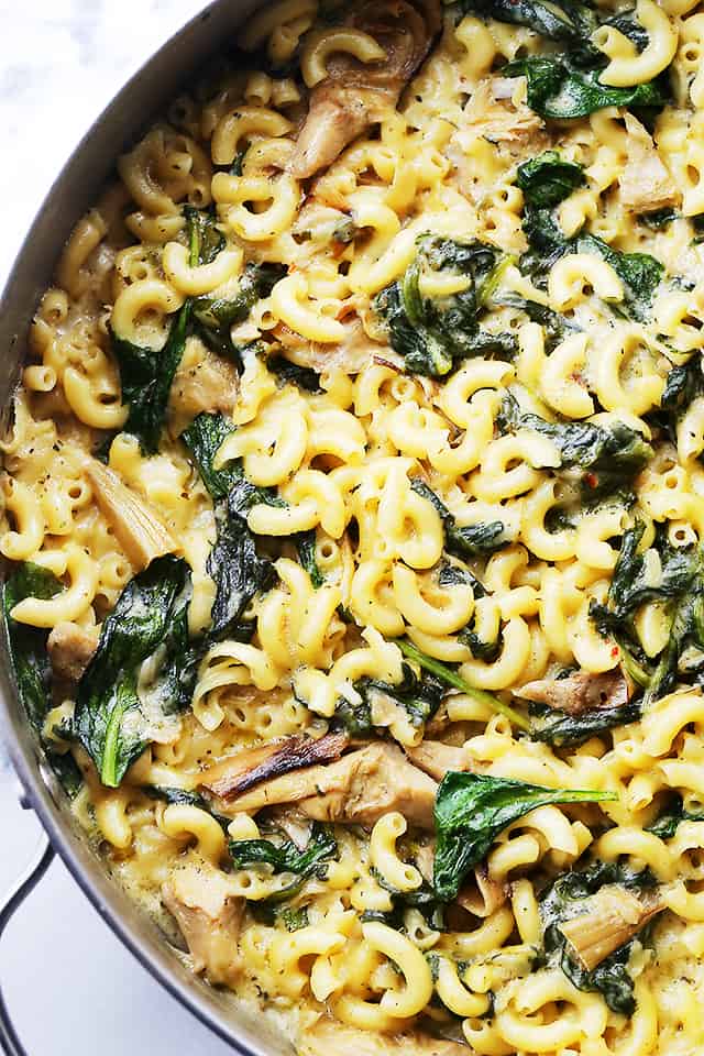 One Pot Spinach & Artichokes Macaroni and Cheese - Stove top one-pot Mac ‘n Cheese packed with spinach and artichokes, and a creamy cheese sauce. Dinner will be ready in under 30 minutes!