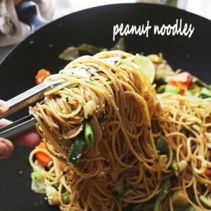 Garlic Peanut Noodles Recipe - Delicious noodles and stir fried vegetables are tossed in garlic olive oil and coated in a mixture of peanut butter, soy sauce, lime juice, hot sauce and ginger.